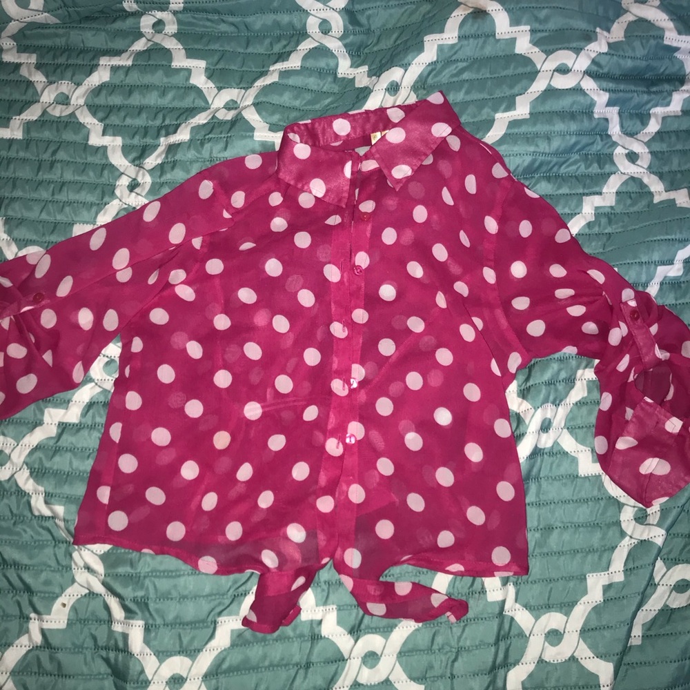 Woman’s pink polka dot blouse